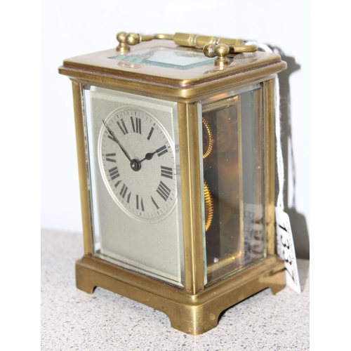 1337 - A vintage French brass cased carriage clock with unusual silvered face, mechanical movement with key