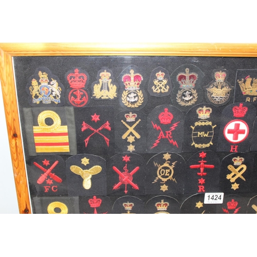 1424 - Framed collection of over 50 20th century Royal navy patches