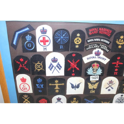 1425 - Framed collection of 50 20th century Royal Navy patches