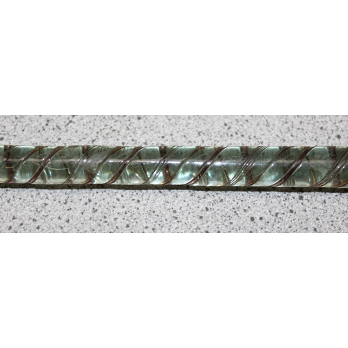 1686 - An antique Nailsea glass cane, approx 74cm long