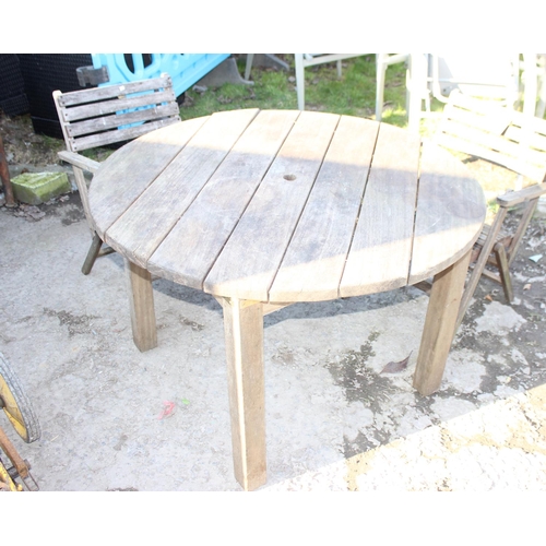 339 - Round slated teak garden table and 2 teak folding chairs, approx diameter 114cm