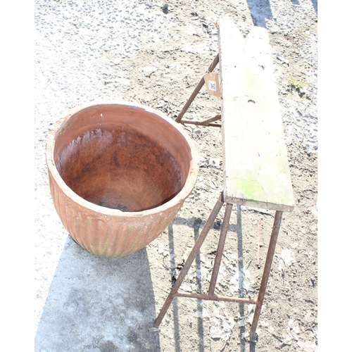 340 - Ribbed terracotta garden pot and a vintage sawhorse