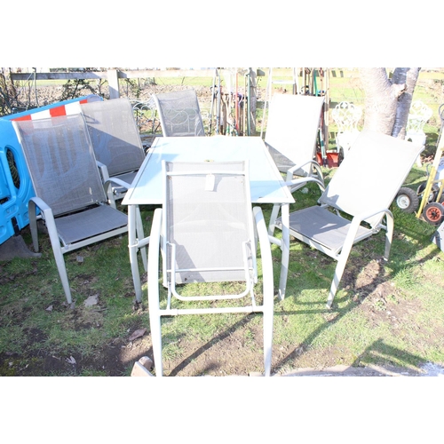 341 - Aluminium framed glass top garden table with 6 folding chairs. approx width of table 153cm