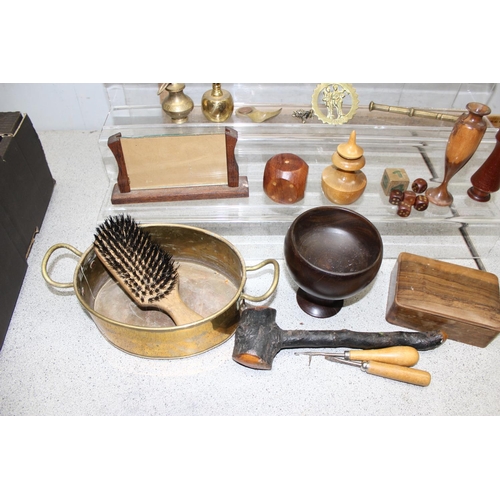 1821 - Mixed box of wooden and brass ornaments to include a wooden elephant and a pair of brass candlestick... 