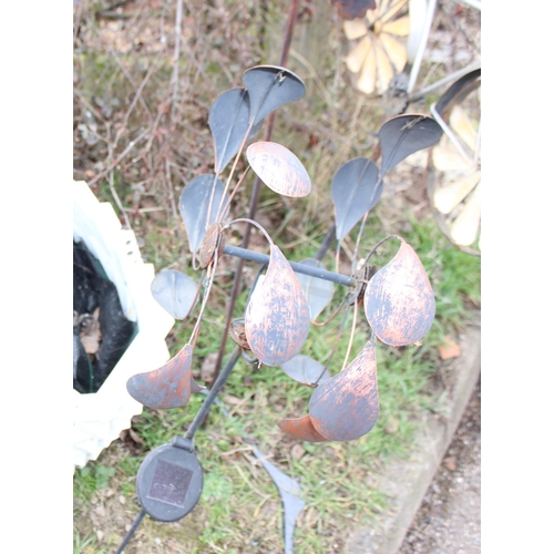 317 - 3 metal garden wind ornaments & two wooden hanging planters