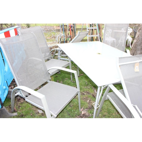 341 - Aluminium framed glass top garden table with 6 folding chairs. approx width of table 153cm