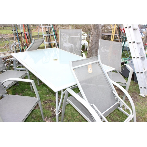 341 - Aluminium framed glass top garden table with 6 folding chairs. approx width of table 153cm