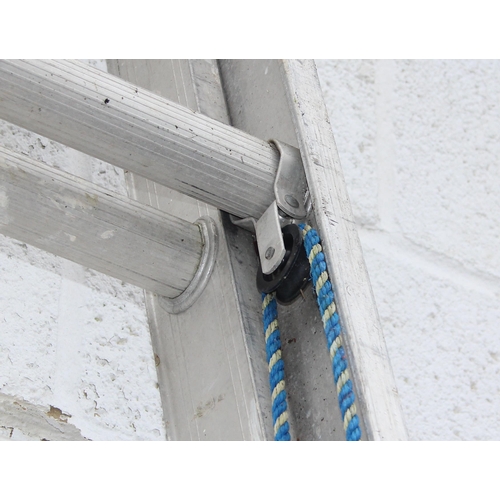 829 - Aluminium extension ladder each sections measures approx. 3 meters