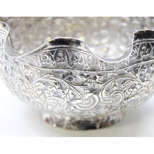 1067 - A high grade silver bowl with frilled edge and embossed decoration, likely Indian in origin, unmarke... 