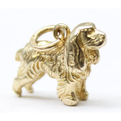 1156 - A 9ct gold charm or pendant formed as a Spaniel dog, marked to ring, approx 2.39g gross