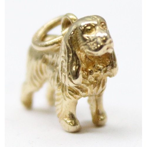 1156 - A 9ct gold charm or pendant formed as a Spaniel dog, marked to ring, approx 2.39g gross