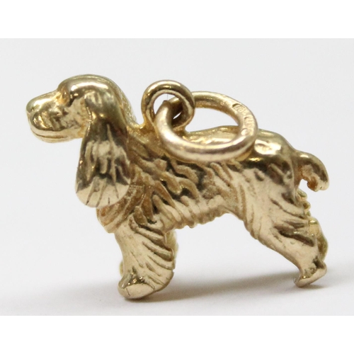 1156 - A 9ct gold charm or pendant formed as a Spaniel dog, marked to ring, approx 2.39g gross