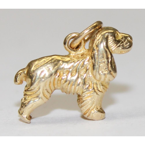 1156 - A 9ct gold charm or pendant formed as a Spaniel dog, marked to ring, approx 2.39g gross