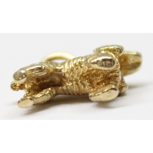 1156 - A 9ct gold charm or pendant formed as a Spaniel dog, marked to ring, approx 2.39g gross