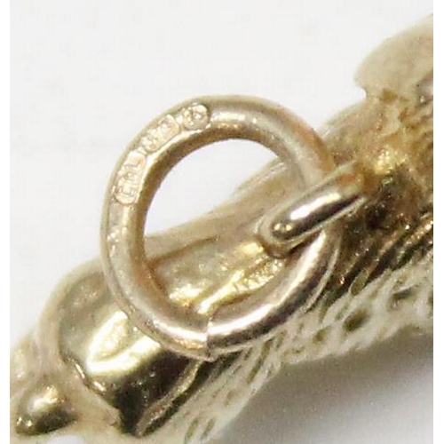 1156 - A 9ct gold charm or pendant formed as a Spaniel dog, marked to ring, approx 2.39g gross