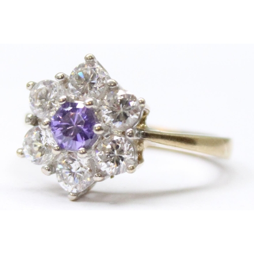 1157 - A 9ct gold floral cluster ring set with 5 white stones set round a central amethyst, approx size Q, ... 