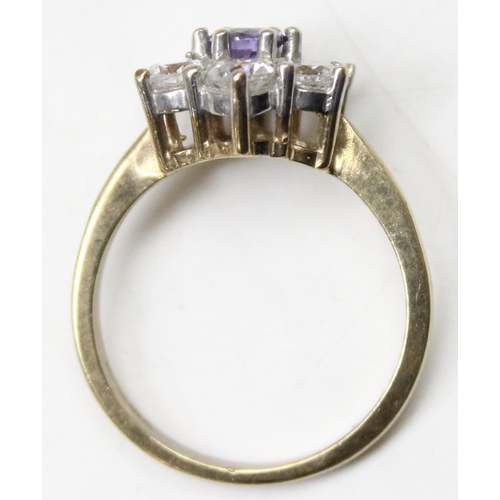 1157 - A 9ct gold floral cluster ring set with 5 white stones set round a central amethyst, approx size Q, ... 