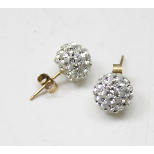 1160 - A pair of 9ct gold mounted white stone cluster stud earrings, in box