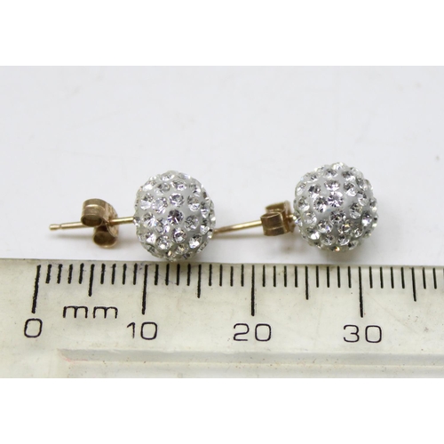 1160 - A pair of 9ct gold mounted white stone cluster stud earrings, in box