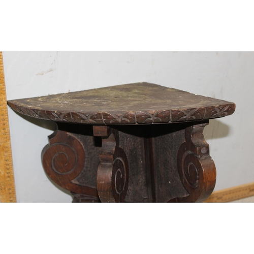 140 - Antique carved oak wall bracket, approx height 42cm