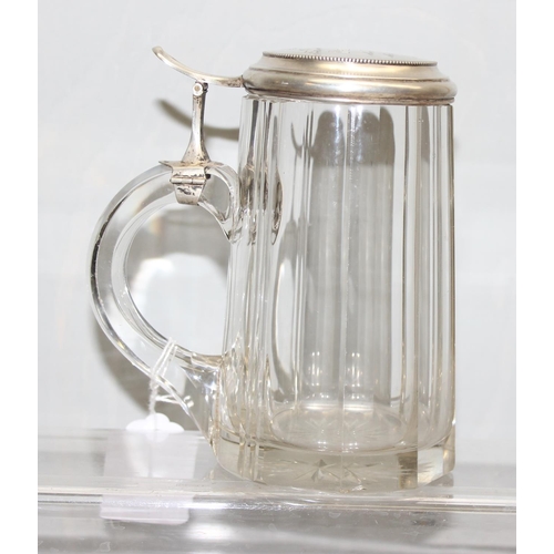 1064 - A German facet cut glass and 0.800 silver lidded stein, inscribed for Berlin 1938, approx 16cm tall