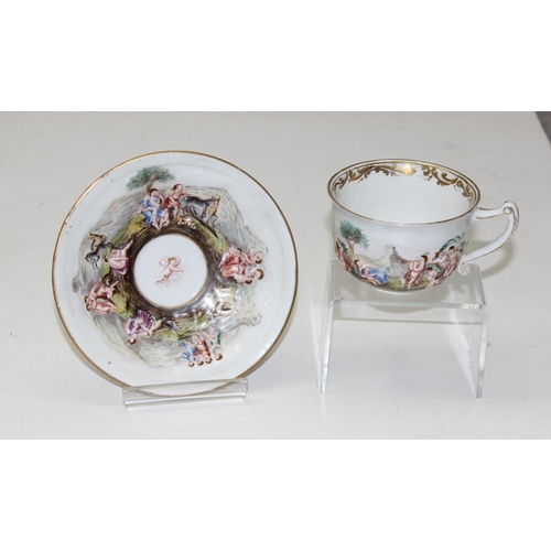 1693 - A 19th century Capodimonte cabinet cup and saucer with hand painted relief decoration & a Meissen Au... 