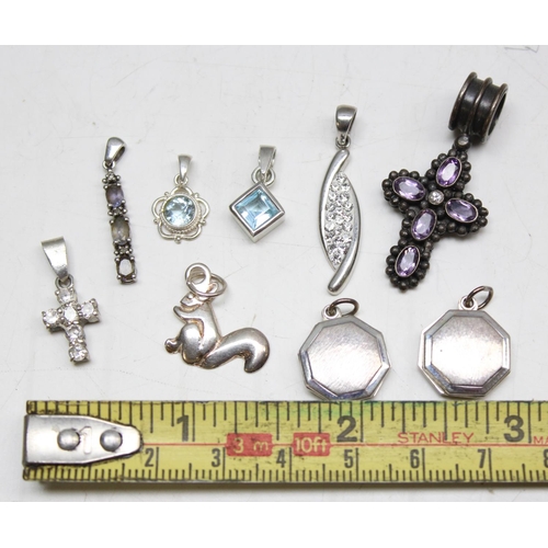 1168 - 9 assorted silver mounted pendants and lockets