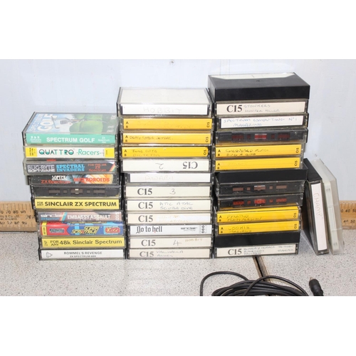 1575 - Sinclair ZX Spectrum computer and a large qty of assorted cassette games etc