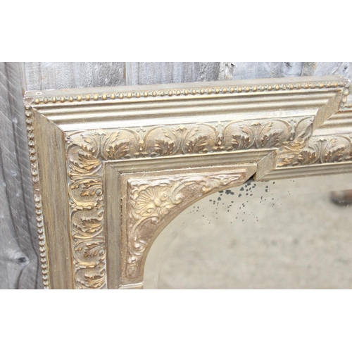 458 - A large vintage gilt framed wall mirror with squared stepped corners and bevelled glass plate, appro... 