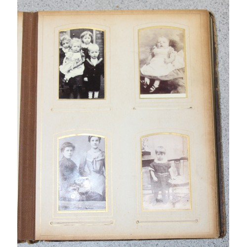 541 - A Victorian photograph album and contents, many photographs