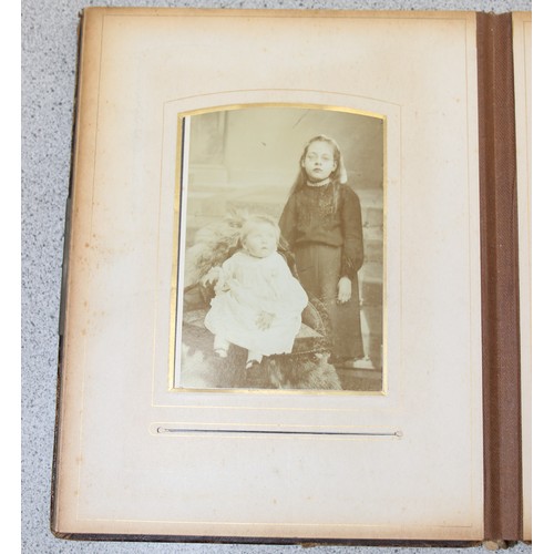 541 - A Victorian photograph album and contents, many photographs