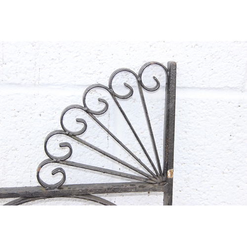 305 - A pair of heavy duty decorative wrought iron garden gates with posts, each approx 116cm wide