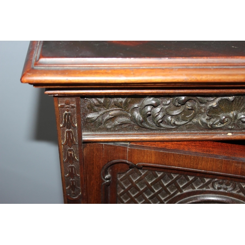 23 - A late 19th or early 20th century carved wooden sideboard by Maple & Co of London & Paris, 2 cupboar... 