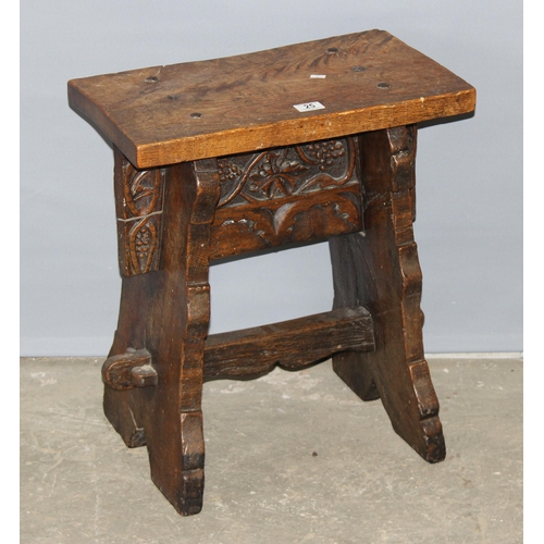 25 - An unusual antique oak or elm stool or side table with carved details and hand forged ironwork, appr... 