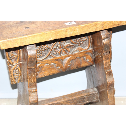 25 - An unusual antique oak or elm stool or side table with carved details and hand forged ironwork, appr... 