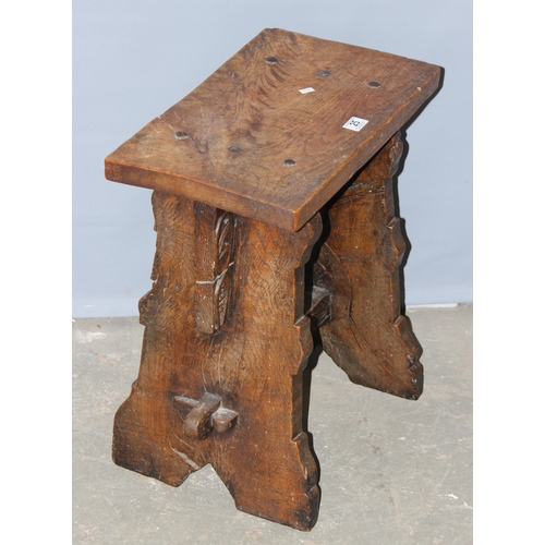 25 - An unusual antique oak or elm stool or side table with carved details and hand forged ironwork, appr... 