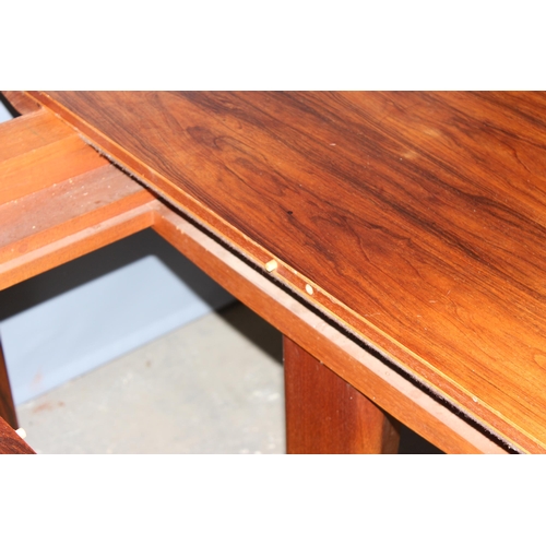 33 - Gordon Russell, a retro mid-century extending dining table with extra leaf, believed to be either te... 