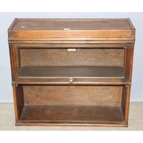 34 - An early 20th century 2 section modular Globe Wernicke bookcase with one glazed folding door, approx... 