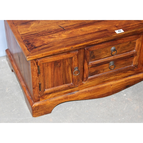 42 - A heavy modern mango wood coffee table with 4 cupboards and a drawer, approx 90cm wide