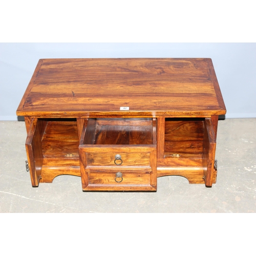 42 - A heavy modern mango wood coffee table with 4 cupboards and a drawer, approx 90cm wide