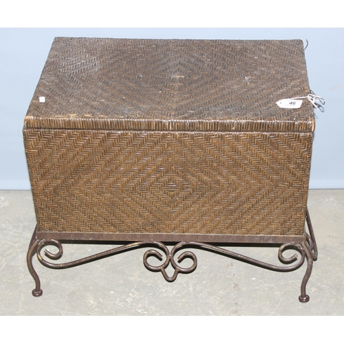 46 - A woven rattan storage box with wrought iron stand, approx 58cm wide