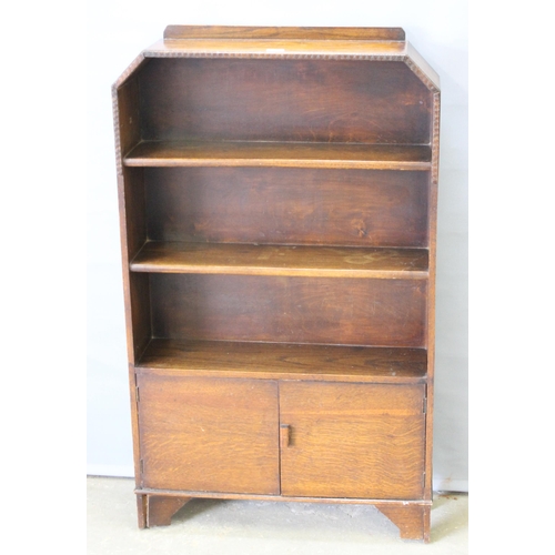 49 - A vintage Art Deco period oak bookcase with cupboard, approx 74cm wide