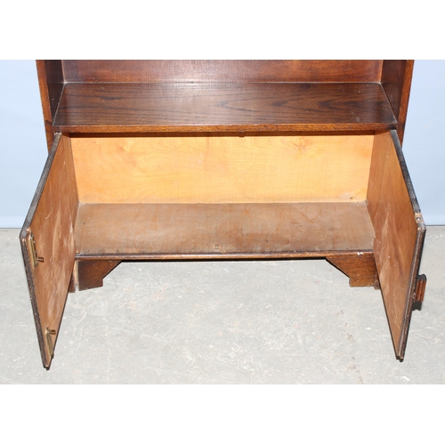 49 - A vintage Art Deco period oak bookcase with cupboard, approx 74cm wide