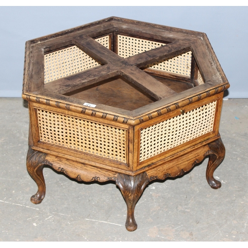 51 - An unusual vintage hexagonal low table with carved oak frame and bergere sides, approx 66cm wide