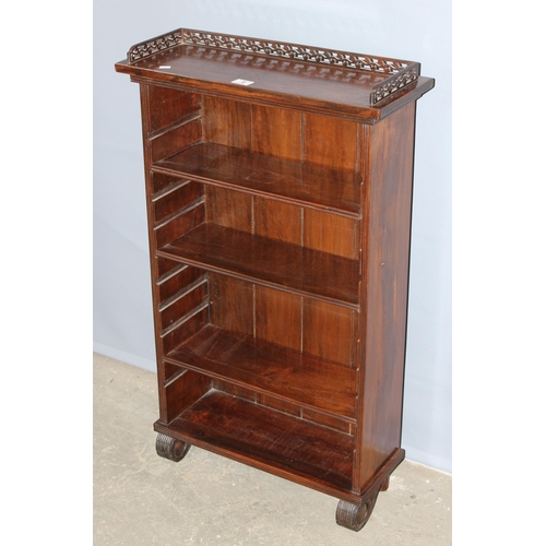 6 - A 20th century mahogany bookcase with fretwork top and adjustable shelves, approx 60cm wide