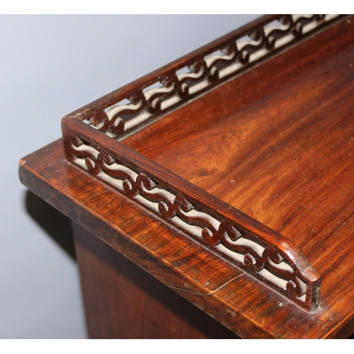 6 - A 20th century mahogany bookcase with fretwork top and adjustable shelves, approx 60cm wide