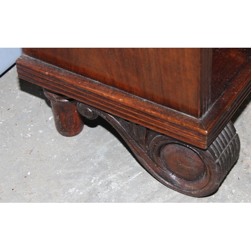 6 - A 20th century mahogany bookcase with fretwork top and adjustable shelves, approx 60cm wide