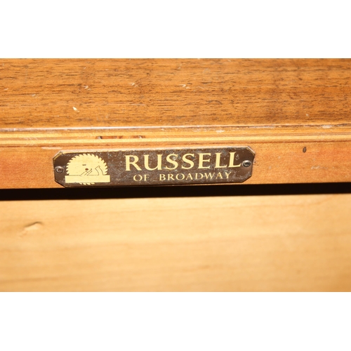 67 - A retro Gordon Russell sideboard, a bank of 3 drawers flanked by 2 cupboards, label verso, approx 14... 