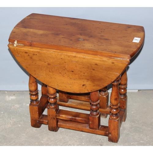 9 - A small yew wood dropleaf side table, approx 56cm deep when closed