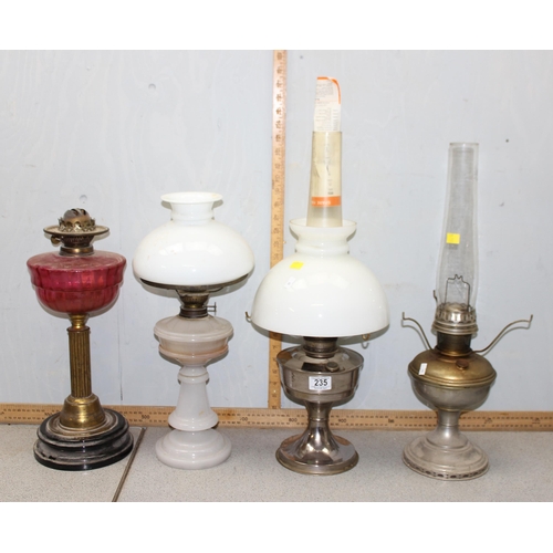 235 - 4 assorted antique and later oil lamps